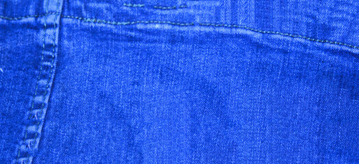 Blue denim background shot with shallow depth of field close-up macro