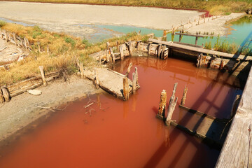 Board walks running through the different pools of the Burgas Salt Pans, filled with pink and...