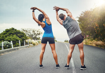 Runner, training and couple stretching in morning outdoor for benefits to health, wellness and...