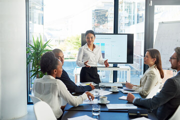 Business woman, coach and presentation with team in meeting for discussion on corporate revenue or...