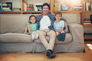 Family, relax and father with children, couch and laughing for joke by dad, funny and comedy in...