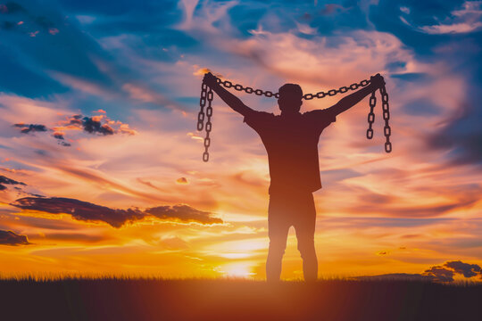 Man breaking chains to become free and independent
