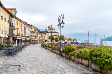 Cannobio, Piedmont, Italy - April 26, 2024: Lakefront of Cannobio with outdoor bars and...