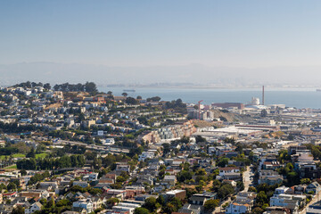 the iconic and breathtaking cityscape panoramic view from above a hill at bernal heights in san...