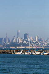 view from a small bay at the Golden Gate Bridge to the cityscape of San Francisco with the high...