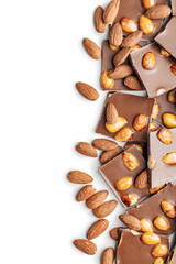 Broken chocolate bar with almonds isolated on white background.