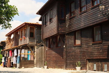 Traditional wooden houses in the old town of Nessebar, Nesebar, one houses a clothing store in the...