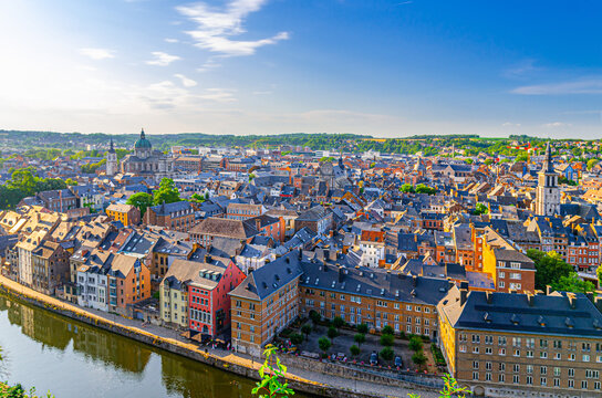 Namur cityscape, aerial panoramic view of Namur city historical center with Sambre river embankment and St Aubin's cathedral, skyline panorama of Namur fields on horizon, Wallonia Region, Belgium