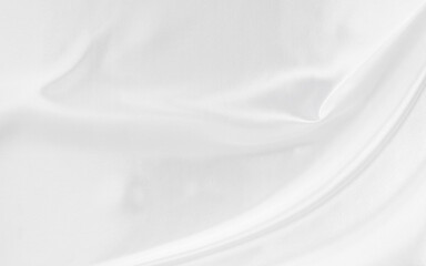 White gray satin texture that is white silver fabric silk background with beautiful soft blur...
