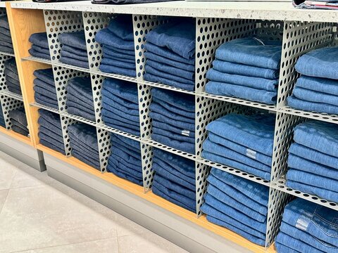 Russia, Moscow - May 14, 2024, the brand of the Just Clothes store, jeans are on the shelf. Aviapark Shopping Center.