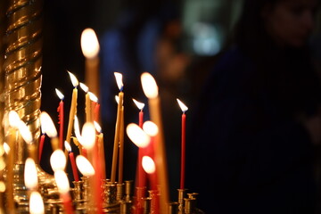 Candles burning in a church, suitable for religious and spiritual concepts