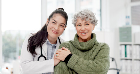 Happy, care and face of a doctor with a woman for medical trust, healthcare and help. Laughing, hug...