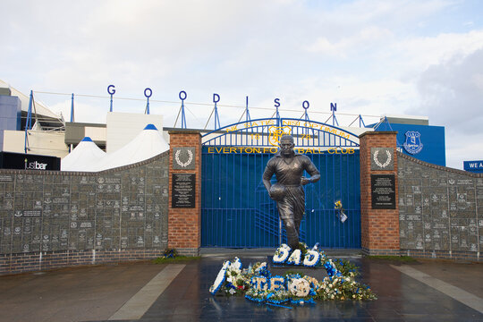 England, Liverpool - December 29, 2023: Bronze figure of Dixie Dean, the Everton FC's greatest ever goalscorer, in front of Goodison Park.
