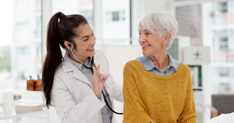 Healthcare, listening and a doctor with a woman for breathing check during a consultation. Talking, help and a medical employee with a stethoscope and senior patient for a heart test at a clinic