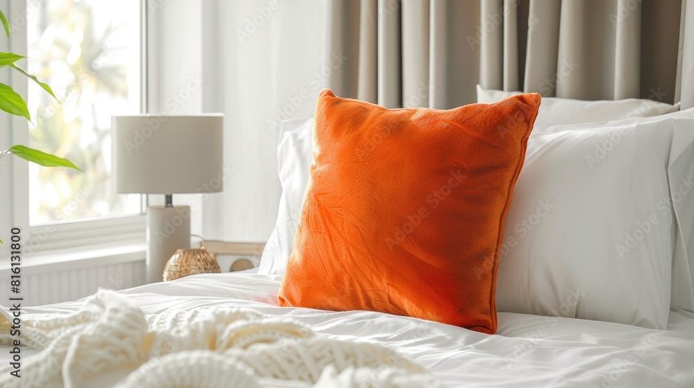 Sticker Orange Pillow on White Bed in Bedroom at Home