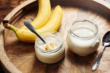 Banana yogurt on a wooden tray.