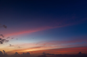 Obraz premium Colorful clouds are under deep blue sky on a sunset