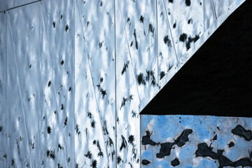 Blue shiny metal wall with a niche, abstract contemporary architecture photo