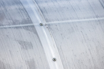 Greenhouse wall made of transparent polycarbonate sheets