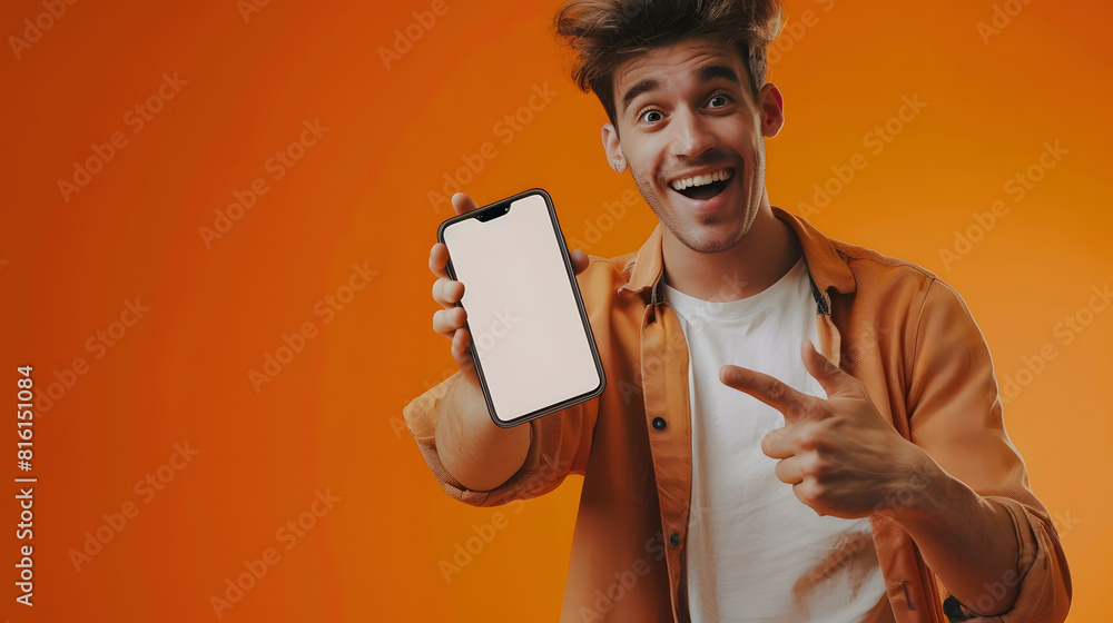 Poster mobile app advertisement handsome excited man showing pointing at white empty smartphone screen posi