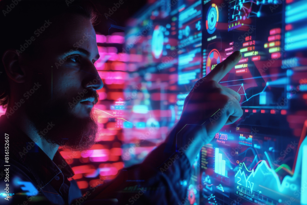 Poster a man is pointing at a screen that shows graphs and numbers