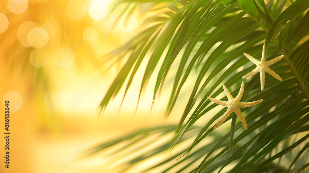 Poster tropical background palm trees branches with blurred starfish on yellow background holiday travel co