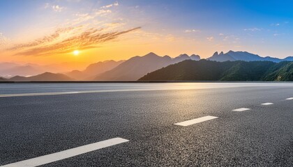 asphalt road and mountain range natural landscape at sunrise panoramic view - Powered by Adobe