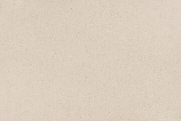 Craft paper texture, a sheet of beige recycled cardboard texture as background