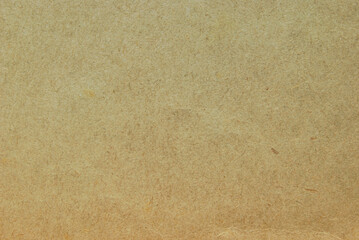 A sheet of brown fibrous recycled cardboard texture as background