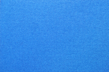 A sheet of blue corrugated cardboard texture as background