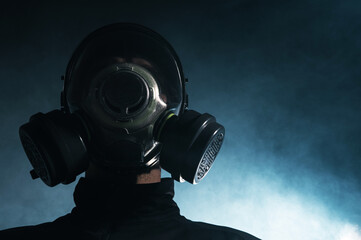 Man in Gas Mask Amidst Smoke