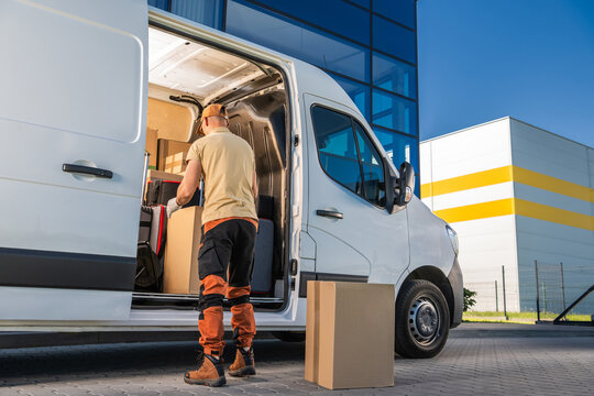 Courier Opening His Moving Van Door Delivering Packages to a Client