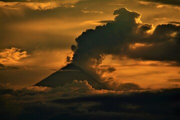 Activity of Sangay stratovolcano (5286 m) as observed at dusk from the Amazonian rainforest at the...