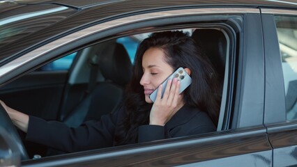 Pretty female in automobile ready to drive