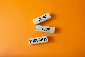 Share your Thoughts symbol. Concept words Share your Thoughts on wooden blocks. Beautiful orange background. Business and Share your Thoughts concept. Copy space.