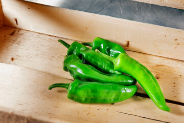 Green peppers , friggitelli in crate
