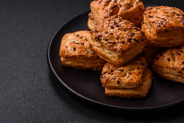 Triangular puffs with feta cheese, tomatoes with salt, spices and herbs
