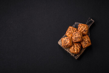 Triangular puffs with feta cheese, tomatoes with salt, spices and herbs