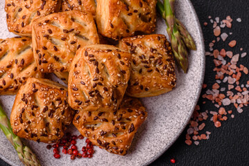 Triangular puffs with feta cheese, tomatoes with salt, spices and herbs