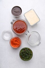 Different marinades on light table, flat lay