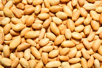 Fresh peeled peanuts as background, top view