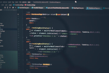 Close up of computer code under magnifying glass on computer screen.
