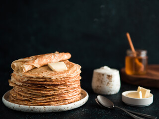 russian pancakes blini on black with copy space
