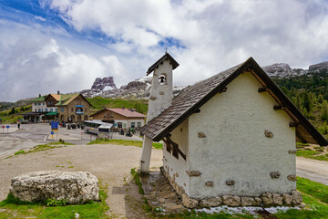 Fototapeta premium Small chapel in Falzarego pass in Dolomites. church in the mountains. Mountain chapel in Dolomites, Tre Cime di Lavaredo National Park, Italy