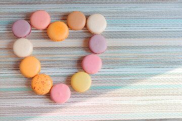 Macaron, typical French sweet, homemade macaron in different flavors and colors.