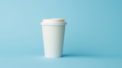 White paper coffee cup mock up on blue background with copy space for branding or advertisement