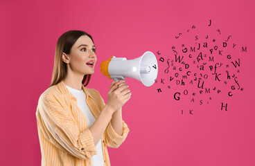 Woman using megaphone on pink background. Letters flying out of device