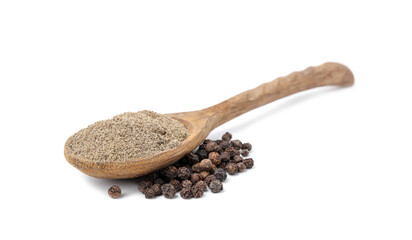 Aromatic spice. Ground black pepper in spoon and peppercorns isolated on white