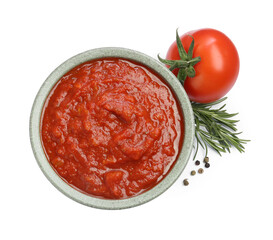 Homemade tomato sauce in bowl and fresh ingredients isolated on white, top view