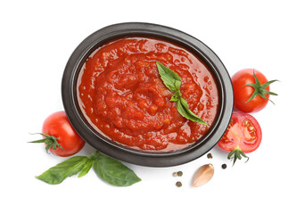 Homemade tomato sauce in bowl and fresh ingredients isolated on white, top view